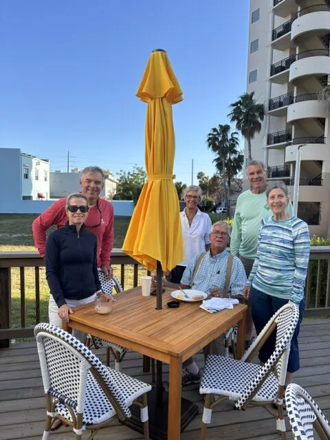 Group of guests on the deck out back.